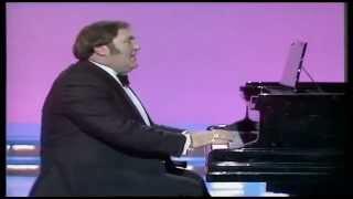 Les Dawson, playing the piano