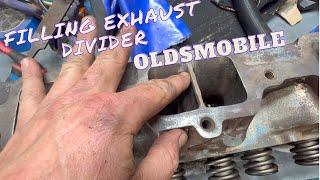 Oldsmobile head work, filling exhaust flange divider.