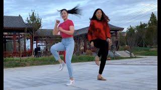 Mother and Daughter dance together in the elegant dance Light clouds cover the moon