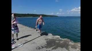 FAT GUY RUNNING AND DIVING IN SLOW MOTION