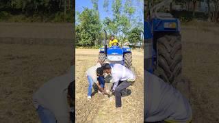 Statue in front of tractor