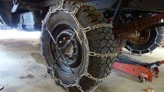 Installing snow tire chains - Heavy duty cleated v-bar chains on my plow truck