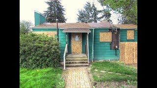 Flip this house!  Boarded up Seattle home up for sale at $450k