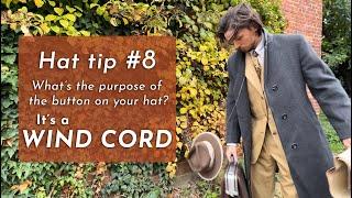 What's the purpose of the button on your hat?  USING YOUR WIND CORD.