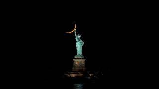 PHOTOGRAPHER CAPTURES CRESCENT MOON BEHIND LADY LIBERAL