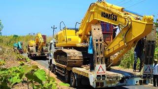 Excavator Transport To The Road Construction Site By Fuso Self Loader Trucks Komatsu PC200 Kobelco