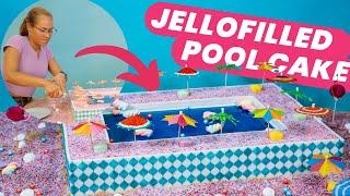 Jello-filled SWIMMING POOL CAKE with  marshmallow floaties  | How to Cake It With Yolanda Gampp