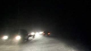 Driving through a blizzard in Poland at night