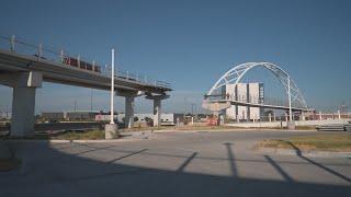 Dallas, TX: New pedestrian bridge building over Central Expressway