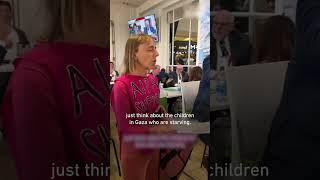 Codepink activist confronts Aipac lobbyists having lunch with pictures of Gaza’s starving children