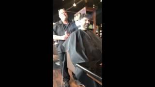 Men's barber styling with old style razor shaving.