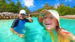 Nastya and dad are having fun on the beach