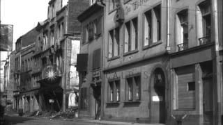 Two soldiers of Allied Armed forces inspect war damaged house in Bonn, Germany wh...HD Stock Footage