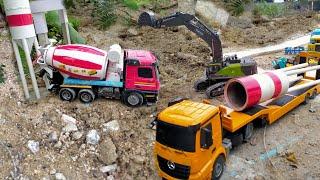 The cement silo was damaged by the storm, construction vehicles cement trucks helped to repair them