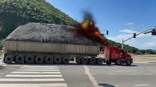 heavily loaded trucks is passing by on the highway. S10-E2