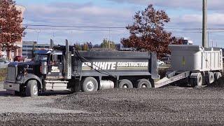 CONSTRUCTION; Western Star Double Trailer Dumping Gravel