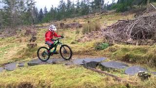 Cuda Impact Full Suspension 24 inch kids mtb review   mountain bike in action over a rock garden