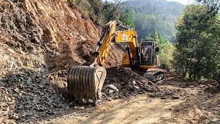 JCB excavator clearing landslide on mountain road | Narrow road construction | Excavator planet