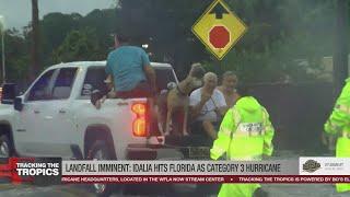 Family and dogs rescued from storm surge in Hudson Beach