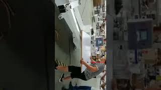 Edge banding machine with folding arm