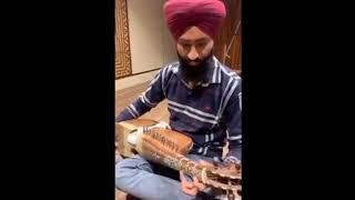 Rabab instrument playing in recording studio. Sikh musical instruments