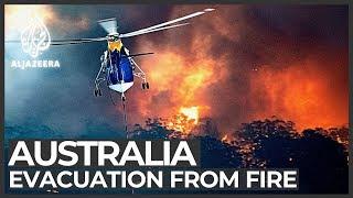 'Worst on record': Thousands flee as Australia's bushfires spread