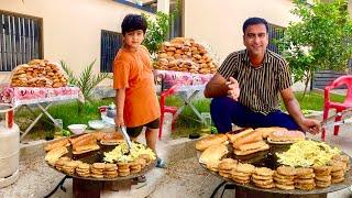 Distributing Burgers Made with Egg & Shami Kabab