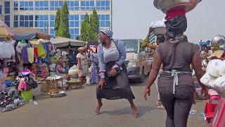 LOCAL MARKET WOMEN DANCING ON STREET, GHANA ACCRA