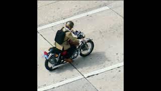 Man on Motorcycle Brickell Vintage Triumph