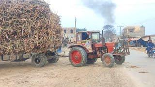 Belarus 510 tractor pulling heavy trailer