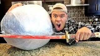 EXPERIMENT Glowing 1000 degree KATANA VS GIANT PLASTIC WRAP BALL! (10,000 LAYERS)