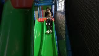 Lola and Ruairí on his first slide