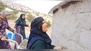 Helping to make Fariba's house in grandma's farm