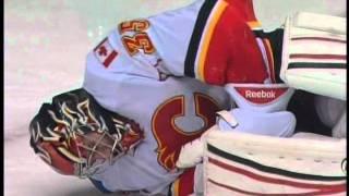 Flames goalie Henrik Karlsson hit in knee on collision