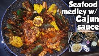 DAMPA BUTTERED GARLIC SEAFOOD WITH CAJUN SAUCE