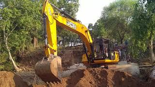 CAT Excavator in working pull pipe Caterpillar CAT Excavator Fitting The Bucket And The First Loads