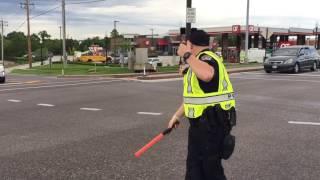 Police directing traffic on Manchester Rd at Clarkson Road