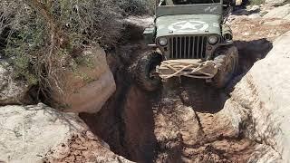 Jeff playing in a muddy sandy hole on Lower Helldorado