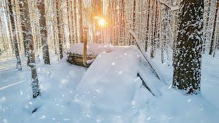 Winter shelter in the wild forest. +30 °C inside. Cooked dinner on the stove. New bed ready.