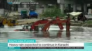 Summer rains flood the streets of Karachi in Pakistan