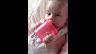 Layla west drinking water on her own