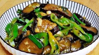 Stir-fried eggplant slices with homemade green peppers are soft, tasty and appetizing, and they a...