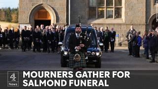 Mourners pay tribute to “giant of a man” Alex Salmond at private service