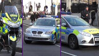 Metropolitan Police Traffic Unit and response car on scene of a collision