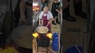 Wok pan. Cooking nuudle with a wok over wood fire . Noodle. fresh food.    Çin yemeği.  SUBSCRIBE