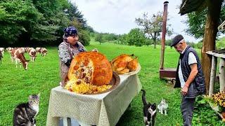 Grandma Cooked Pilaf with Chicken and Dried Fruits in Nature.