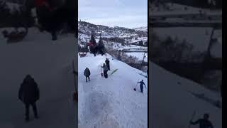 Guy Loses Sledge While Jumping Off Snow Ramp - 1134075