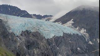 Stunning helicopter flight over Knik Glacier to dog sledding camp in Alaska