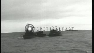 Flanked by US escorts, surrendered German submarine U-234 arrives at dock in Port...HD Stock Footage