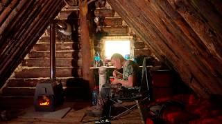 MAN SURVIVES COLD NIGHT IN BIG WARM LOG HOUSE. BUILD A PORCH FROM LOGS.